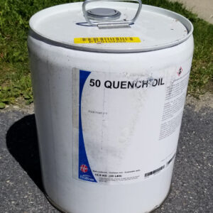 large white chemical container with the label reading 50 quench oil